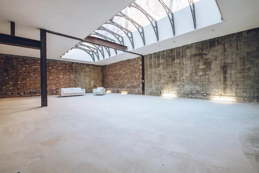 Ideal Glass hall, with a skylight and brick walls